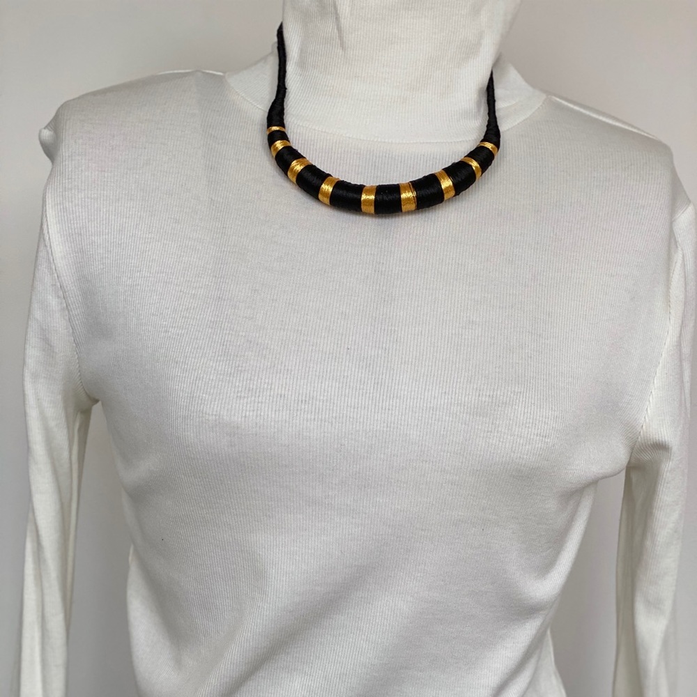 Ethnic- inspired gold and black necklace